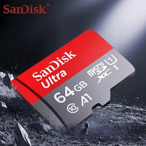 Könnte beinhalten: Eine SanDisk Ultra 64GB microSDXC I Speicherkarte mit rotem und grauem Design. Die Karte zeigt das SanDisk Ultra Logo in Weiß sowie die Kapazitäts- und Geschwindigkeitsklasseninformationen. Die Karte ist für verschiedene Geräte konzipiert.