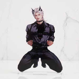 May include: An acrylic standee featuring an illustration of a character with white hair, pointed ears, and a choker, wearing a dark gray button-down shirt with black straps and matching trousers, posed in a kneeling position on a clear base.