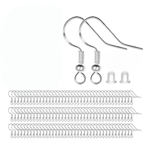 May include: A collection of silver-colored earring hooks, including several pairs of finished hooks with coiled springs and small round beads. Also included are clear, rubber earring backs. The hooks are arranged in rows.