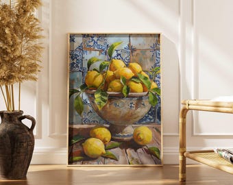 May include: A framed still life painting of lemons. A large, ornate bowl overflows with bright yellow lemons and green leaves. Several lemons rest on a wooden surface in front of the bowl. The background features blue and white patterned tiles.