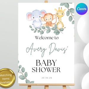 May include: A white rectangular sign featuring watercolor illustrations of a blue elephant, a brown monkey, and a yellow giraffe sitting on green eucalyptus branches. The text reads Welcome to Avery Davis' BABY SHOWER and the date 20.05.26.