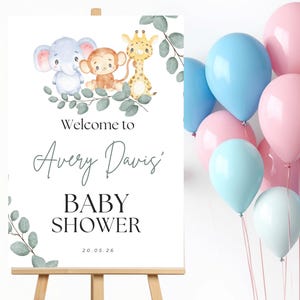 May include: A rectangular welcome sign for a baby shower featuring watercolor illustrations of a blue elephant, a brown monkey, and a yellow giraffe surrounded by green eucalyptus leaves. The text reads Welcome to Avery Davis' BABY SHOWER 20.05.26.