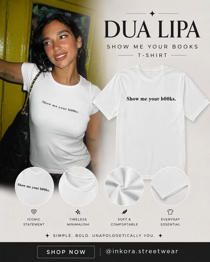 May include: A white short-sleeved t-shirt featuring the black text "Show me your b00ks." printed on the chest. The design includes a crew neckline and a standard fit. The shirt is displayed both on a person and as a flat product shot.