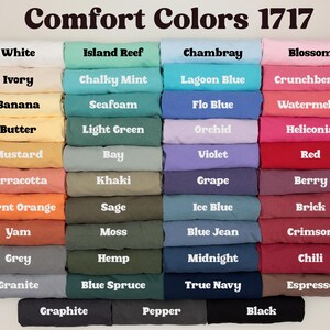 a collection of various colored t-shirts, each with a different color and pattern, arranged in a grid-like pattern.