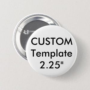May include: Two round, white buttons with a metal backing. One button is face up, displaying the text "CUSTOM Template 2.25". The other button is partially visible, showing the pin backing.