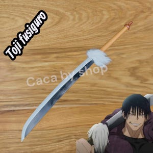 May include: A long, silver sword with a light brown handle and a white fur accent. The text "Toji fusiguro" is in a black and white font. The text "Caca by shop" is also visible.