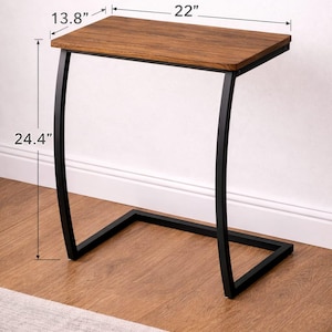 May include: A C-shaped side table with a rectangular brown wood-grain top and a black metal frame. The table measures 22 inches in length, 13.8 inches in width, and stands 24.4 inches tall, featuring a curved support structure and a flat base.