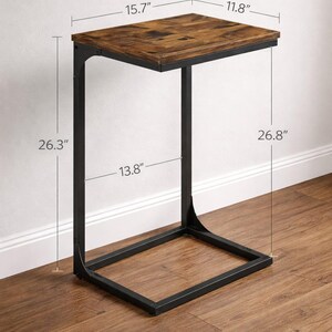 May include: A side table with a rectangular, wood-look top and a black metal frame. The table top is 15.7" x 11.8", and the table is 26.3" high. The base is 13.8" wide and 26.8" long. The table is designed to slide under a sofa.