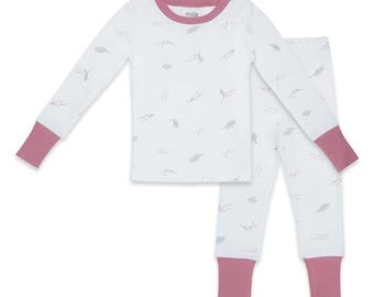 May include: A white long-sleeve pajama set featuring a subtle gray botanical leaf pattern. The top has a round neckline and the pants have an elastic waistband. Both the sleeves and pant legs are finished with solid mauve ribbed cuffs.