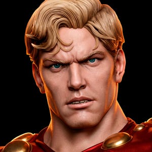 May include: A sculpted bust of a figure with blonde hair styled in a side part, bright blue eyes, and a stern facial expression. The figure wears a red garment adorned with smooth, round, metallic gold accents along the neckline and shoulders.