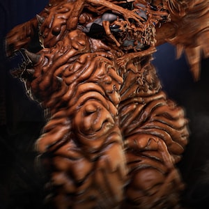 May include: A detailed, brown, monster-like sculpture with a textured, organic appearance. The figure has multiple horns and a complex, layered design. The image includes the text "PRESSUPPORT READY 1-6 SCALE" and "AVAILABLE ON PATREON".