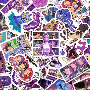May include: A collection of assorted vinyl stickers featuring anime-style characters with purple hair, a blue cat-like creature, and text including Rumi, KPOP, and HUNTRUX. The stickers display various scenes, portraits, and graphic illustrations.