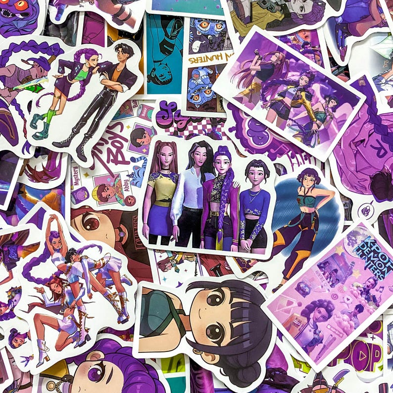 May include: A collection of assorted stickers featuring anime-style illustrations of characters with purple hair, musical themes, and K-pop inspired outfits. The designs include group portraits, individual character poses, and text reading K-POP DEMON HUNTERS.