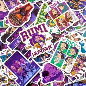 May include: A collection of colorful vinyl stickers featuring anime-style characters named Mira, Rumi, and Zoey. The designs include text such as KPOP DEMON HUNTERS MIRA, RUMI HUNTRVX EST 2025, and ZOEY HUNTRVX, with various poses and vibrant purple, green, and yellow accents.