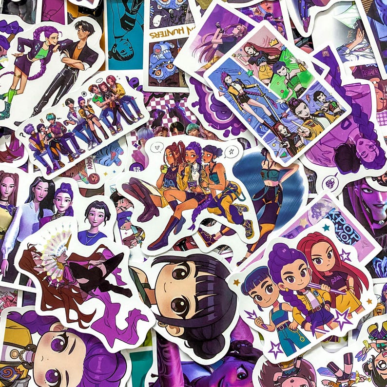 May include: A collection of assorted vinyl stickers featuring anime-style illustrations of characters with vibrant purple, yellow, and green clothing. The designs include various group poses, individual portraits, and chibi-style figures with stars and text.