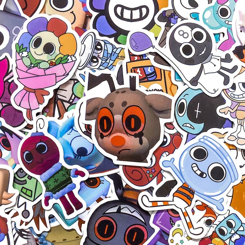 May include: A collection of assorted vinyl stickers featuring various cartoon characters, including a brown creature with orange eyes, a blue jar-shaped figure, a flower bouquet, and an eight-ball character, all with white die-cut borders.