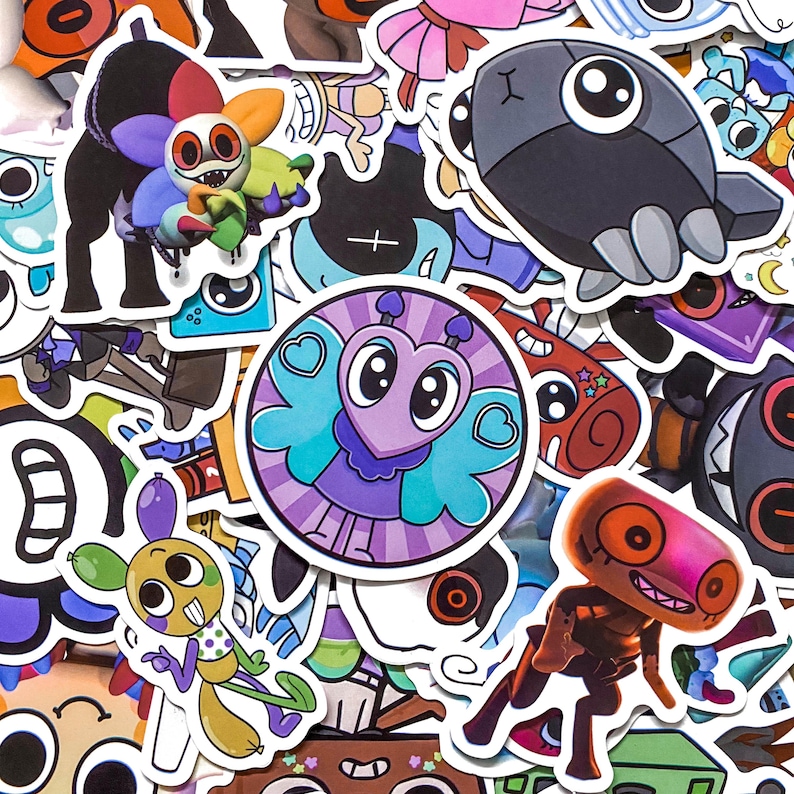 May include: A collection of assorted vinyl stickers featuring various cartoon characters and creatures. The designs include a central circular purple heart-shaped character, a multi-colored flower creature, a grey robotic figure, and a yellow insect-like being.