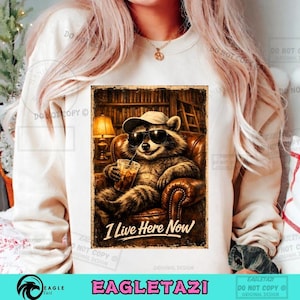 I Live Here Now PNG: Funny Raccoon Book Lover Cozy Reading Late Night Bookworm Library Aesthetic (Digital Download)