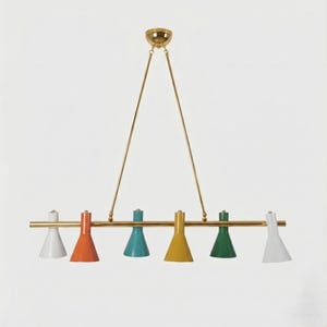 May include: A multi-colored chandelier with six cone-shaped lamps. The lamps are white, orange, teal, yellow, green, and white. The fixture has a gold-colored frame and is suspended from the ceiling by two gold rods.