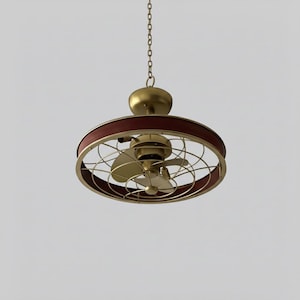 May include: A ceiling-mounted fan light fixture featuring a circular frame with a dark red band, a brass-toned metal cage, and central fan blades. The unit is suspended by a thin metal chain and includes a matching brass-toned canopy at the top.