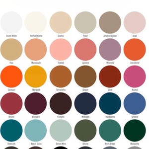 May include: A color chart featuring thirty-six circular swatches arranged in a grid. Each circle displays a unique color with its corresponding name printed in black text underneath, including Stark White, Crema, Coral Reef, and Midnight.