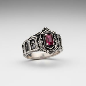 May include: A set of three ceramic mugs with a speckled, matte finish in cream, light grey, and dark grey. Each mug has a simple, minimalist design and a rounded handle. The mugs are stacked on top of each other.