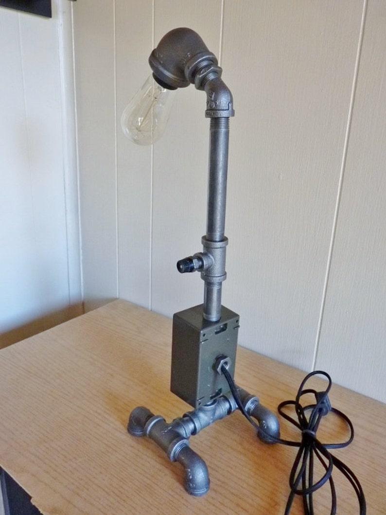 8 ft Black iron pipe lamp with built in electric outlet very cool! cloth cord antique style bulb