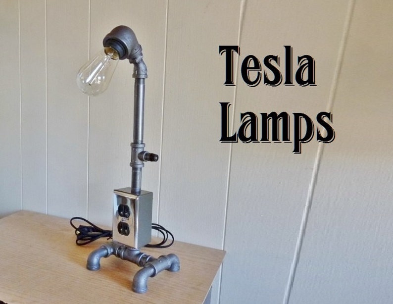 8 ft Black iron pipe lamp with built in electric outlet very cool! cloth cord antique style bulb