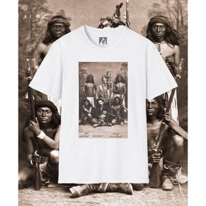 May include: White t-shirt featuring a sepia-toned image of Native American men and a man in a hat. The image is centered on the shirt, with a vintage aesthetic. The shirt has a crew neck and short sleeves.