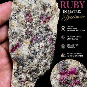 May include: A 962.40 carat natural ruby in matrix specimen from Batakundi, Kashmir, Pakistan. The stone features a rough, textured surface with embedded vibrant magenta-red ruby crystals, grey mineral deposits, and white crystalline rock.