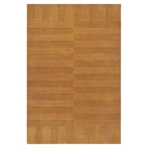 May include: A rectangular, golden-brown rug with a geometric pattern. The design features horizontal bands of varying widths, interspersed with vertical rectangular blocks at the top and bottom. The rug has a textured appearance.