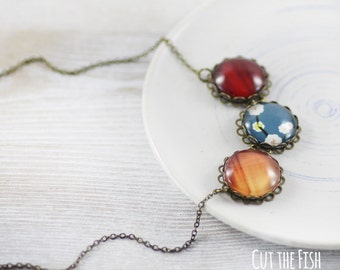 Red Orange and Blue Jewelry in Vintage Bronze