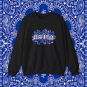 May include: Black crewneck sweatshirt with a blue and white paisley design in the background. The sweatshirt features the text "MS13" in a stylized font, with a blue and white paisley pattern.