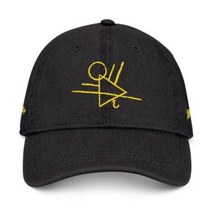 May include: A black baseball cap with a yellow embroidered design. The design features a circle, a triangle, and a line with an arrow.