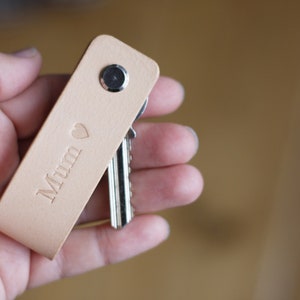 Handmade minimalist design leather key holder. Personalised key pouch.