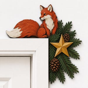 May include: A wooden door corner decoration featuring a carved orange and white fox sitting atop a cluster of green pine needles, two brown pinecones, and a central five-pointed yellow star, designed to mount on the frame of a door.