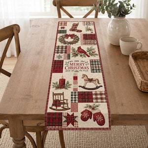 May include: A rectangular table runner featuring a patchwork design with Christmas motifs including a stocking, wreath, cardinal, rocking horse, rocking chair, and mittens. The text Merry Christmas is printed in the center on a cream background.