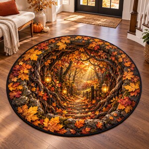 May include: A round area rug featuring a 3D-style print of a forest path lined with gnarled tree roots and stone steps. The scene is covered in vibrant orange, red, and yellow autumn leaves, illuminated by glowing lanterns hanging from the branches.