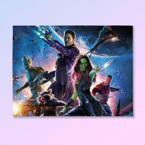 May include: A rectangular print featuring the Guardians of the Galaxy characters in a space-themed action scene. The image showcases Star-Lord, Gamora, Drax, Rocket, and Groot, with a vibrant color palette of blues, greens, and purples.