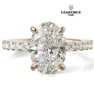 May include: A gold engagement ring featuring a large oval-cut diamond. The band is set with smaller diamonds. The ring is displayed on a white background. The Gemforge CAD logo is visible in the top right corner.