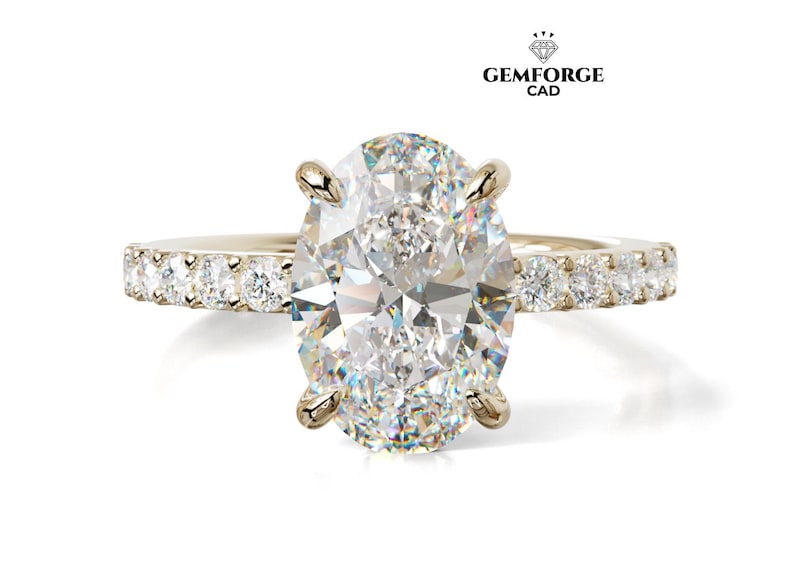 May include: A gold engagement ring featuring a large oval-cut diamond. The band is set with smaller diamonds. The ring is displayed on a white background. The Gemforge CAD logo is visible in the top right corner.