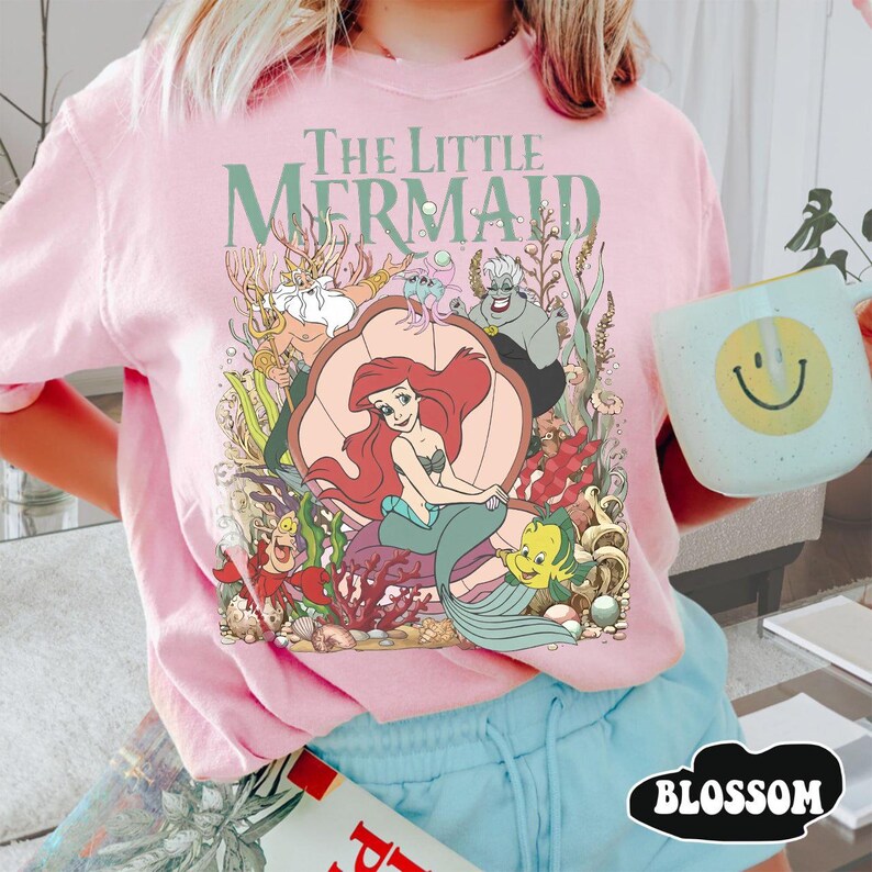 May include: A set of three ceramic canisters with lids, featuring a blue and white floral pattern. The canisters vary in size, with the largest measuring approximately 8 inches in height. The design includes intricate details and a glossy finish.