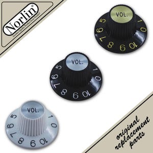 May include: Three circular volume control knobs labeled VOL. with numbers 1 through 10. One knob is white with black text, one is black with white text, and one is black with gold text. The Norlin logo and the text original replacement parts are visible.