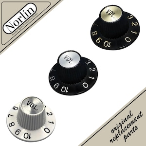 May include: Three black and white guitar volume control knobs with the word "VOL." on the top. The knobs have numbers from 0 to 10. The image also includes the text "original replacement parts."