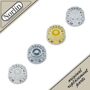 May include: Four circular control knobs with numbered scales from 0 to 10, featuring a fluted edge design. The knobs are presented in clear, yellow, and white translucent finishes. The image includes the Norlin logo and the text original replacement parts.