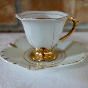 Sweet vintage demitasse from Japan white porcelain 24K gold trim petal shaped cup and leaf saucer