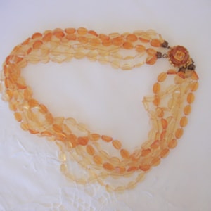 Gorgeous lucite beaded torsade necklace 6 strands fancy clasp rhinestone peach apricot