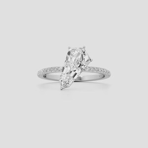 Geometric diamond engagement ring crafted in 14K gold with an elegant pavé shank