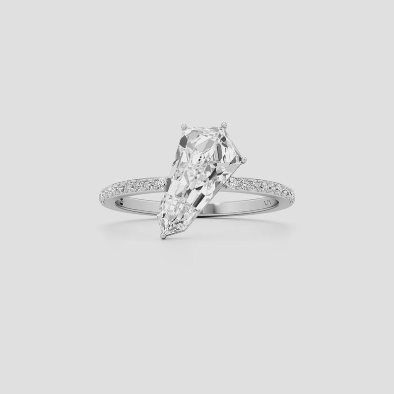 Geometric diamond engagement ring crafted in 14K gold with an elegant pavé shank