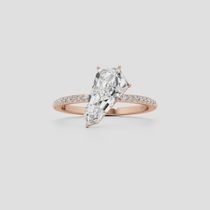 Unique kite cut diamond bridal ring designed with a contemporary solitaire setting